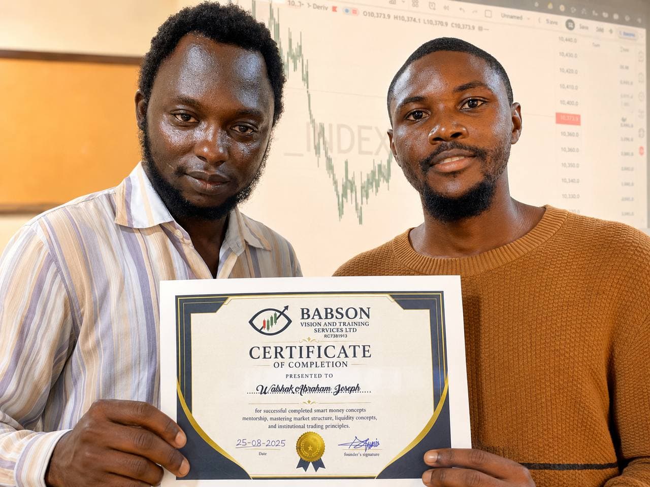 Babson presenting a certificate of completion to graduate Walshak Abraham Joseph